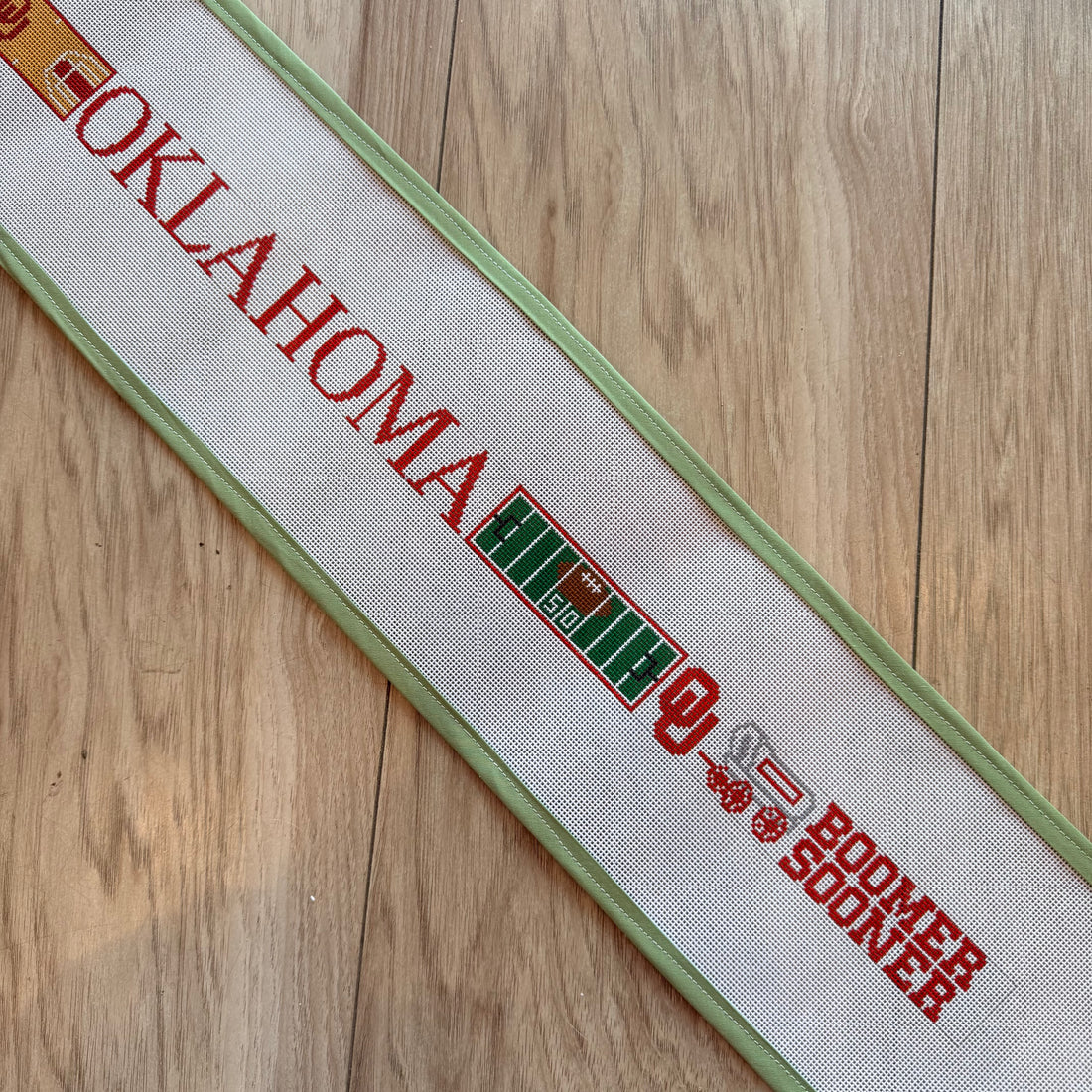 Oklahoma Field & Court-Small Version Belt needlepoint canvas by Elm Tree, 18 mesh 
31" x 1.5"
